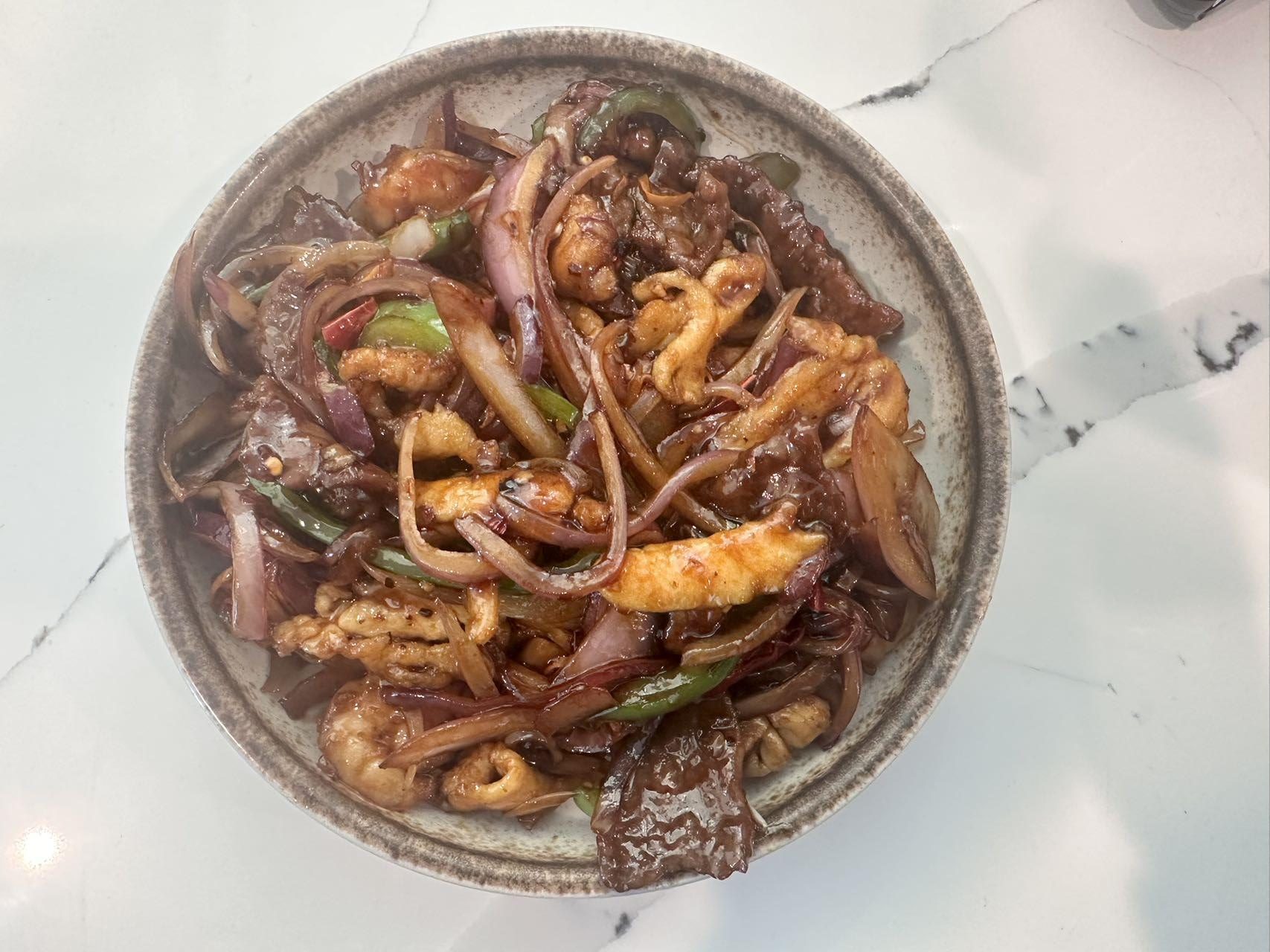 Stir-fried beef and chicken with onions and peppers at No.1 Asian Cuisine Restaurant in Eagle Mountain